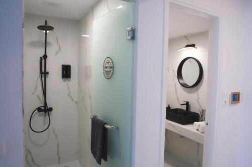a bathroom with a shower and a sink at Apartment Simply 205 in Gázion