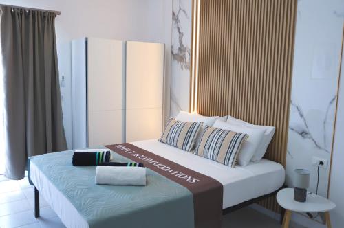 a bedroom with a bed with two pillows on it at Apartment Simply 205 in Gázion
