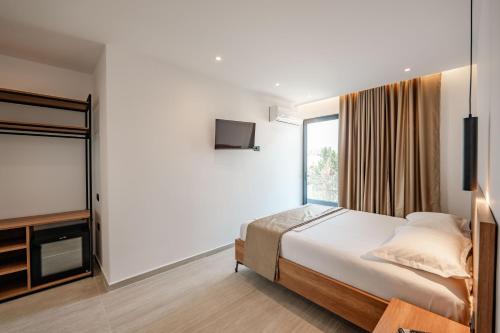 Postel nebo postele na pokoji v ubytování Hotel EN AD