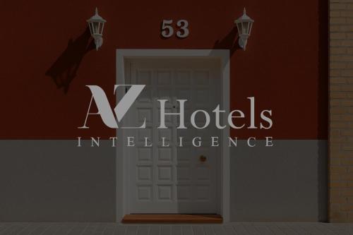 an entrance to a hotel with a white door at AYZ Sierra de Meira - Auto check-in property in Madrid