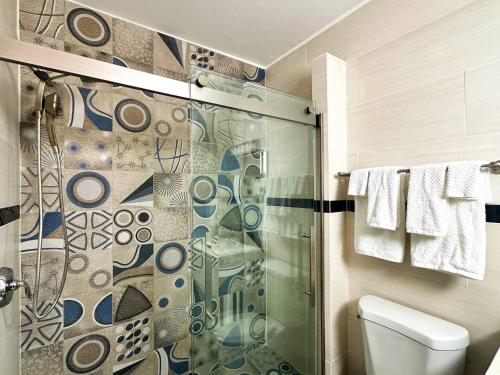 a bathroom with a shower and a toilet at Condado Laguna Villa 1 - Spa - 6 Bd 3Ba Generator in San Juan