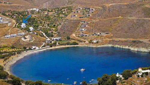 an aerial view of a lake with a boat in it at Serenity Maisonnette in Otzias