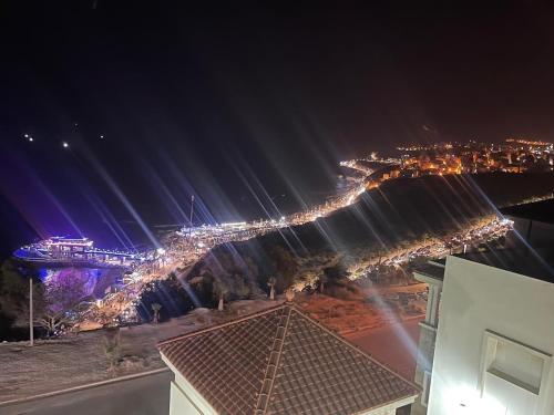 a view of a city at night with lights at Al Hoceima Hay Bades Villa in Al Hoceïma