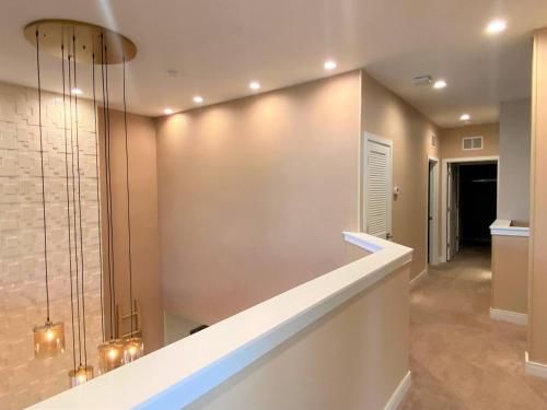a hallway of a home with a wall at Beautiful Home W 3 En Suites & Breathtaking View in Orlando