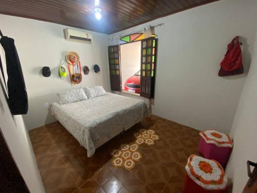 a bedroom with a bed and a ladder in it at Casa na Cidade Nova in Ananindeua