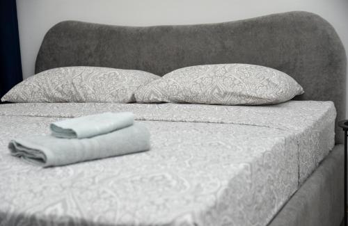 Postel nebo postele na pokoji v ubytování Nano Apartment