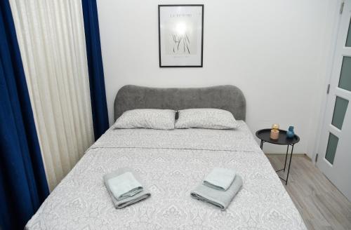 Postel nebo postele na pokoji v ubytování Nano Apartment