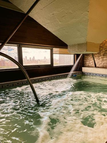a large swimming pool with a water fountain at Los Silos Hotel in Santa Fe