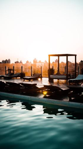 a pool of water with several boats in it at Los Silos Hotel in Santa Fe