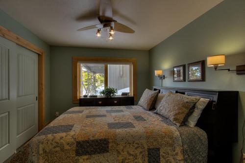 a bedroom with a bed and a window at Rock Haven condo in Stateline