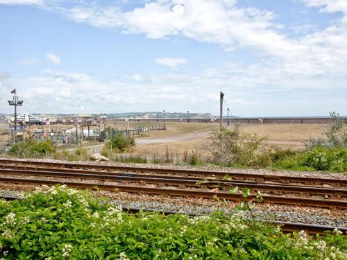 a group of train tracks with a field in the background at Brunel Boutique Railway Carriage 5 in Dawlish Warren