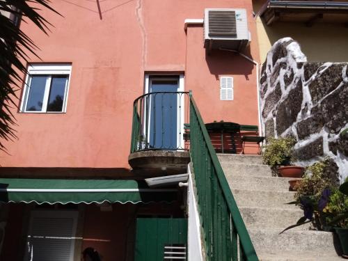 a staircase leading up to a building with a balcony at Metro Casa Música Apartments and Rooms in Porto