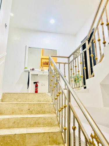 a staircase in a house with a red fire hydrant at 3Apartments in Lagos