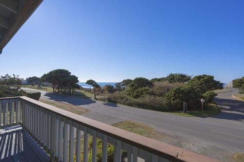 a view from the balcony of a house with a road at Ocean Aire in Bandon