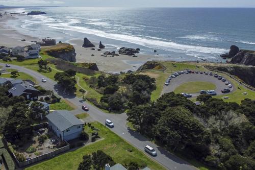 an aerial view of a road next to the ocean at Ocean Aire in Bandon