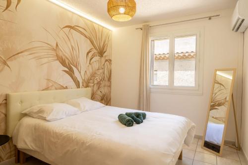 Postel nebo postele na pokoji v ubytování Serignan Village Appartement