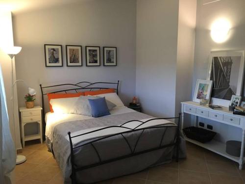 A bed or beds in a room at La Casa Di Stefania
