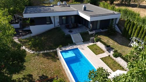an aerial view of a house with a swimming pool at Rent Your Family Retreat in Novi Sad in Novi Sad