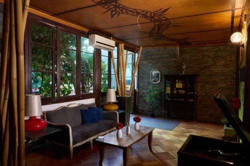 a living room with a couch and a table at Hostal Providencia in Santiago
