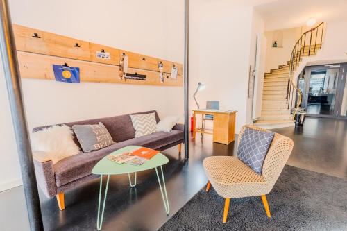 a living room with a couch and a table at SOON APT Nr 1 in Simmern