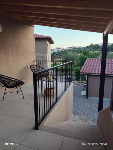 a balcony of a house with a fence and a bench at Tapada das Carvalhas in Castelo Branco