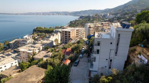 an aerial view of a city next to the water at Hotel Ble Ble Vlore in Vlorë