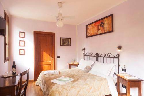 Кровать или кровати в номере Agriturismo Il Cavicchio