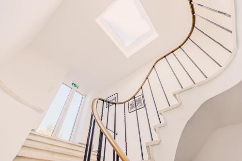 a white staircase with a round glass balustrade at SOON APT Nr 3 in Simmern