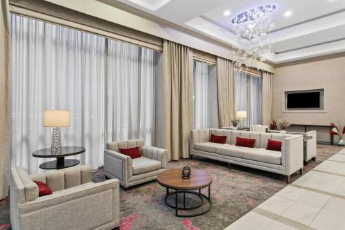 a living room with two couches and a table at Sonesta Hotel Baltimore Inner Harbor in Baltimore