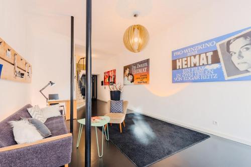 a living room with a couch and a table at SOON APT Nr 5 in Simmern