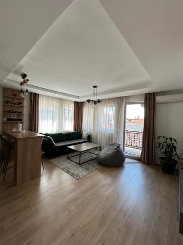 a living room with a couch and a table at Apartments Stećak in Sarajevo