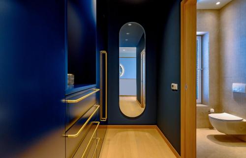 a bathroom with a toilet and a sink and a mirror at Immensely Luxurious Hvar Villa 5 Bedrooms Villa East Eternal Exceptional Sea Views & Private Pool in Hvar