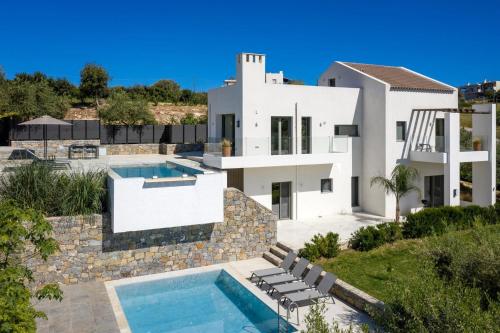 an image of a villa with a swimming pool at Magnificent Crete Villa 4 Bedrooms Villa Ánthos Two Large Private Pools & Jacuzzi Bbq Close To The Beach Rethymno in Prínos