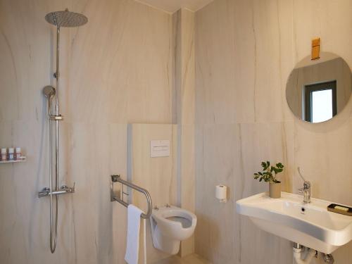 a bathroom with a toilet and a sink and a shower at Magnificent Crete Villa 4 Bedrooms Villa Ánthos Two Large Private Pools & Jacuzzi Bbq Close To The Beach Rethymno in Prínos