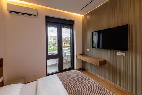 TV a/nebo společenská místnost v ubytování Pristina Select Apartments