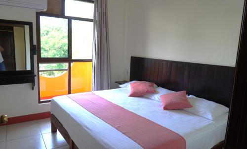 Una cama o camas en una habitación de Bacanda Hotel
