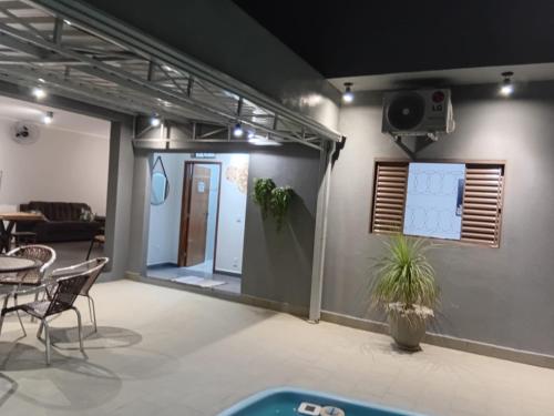 a room with a set up with a projector at casa inteira com 3 suites e área de lazer in Delfinópolis