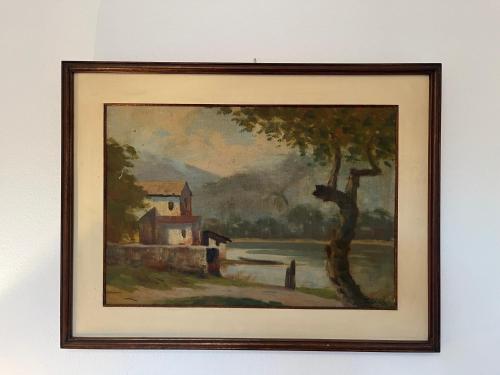 a painting of a house and a tree at Apartamento completo em Caxambu in Caxambu