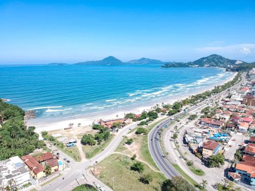 an aerial view of a beach and the ocean at Ka'a Guest House in Ubatuba