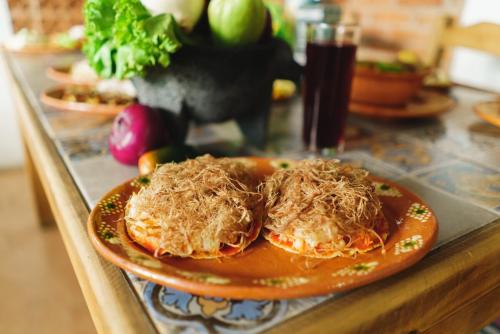 a plate of food on a table with a drink at Beatiful aparment in the magical town of Orizaba 3 in Orizaba