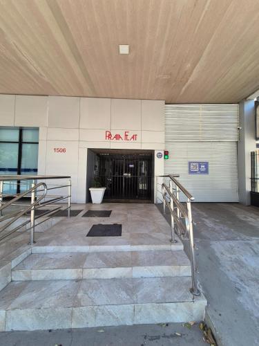 an entrance to a building with a sign that readsarma at Quarto e Sala com Estilo e Conforto in Vitória