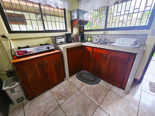 a small kitchen with a sink and a stove at Hormiga's Houses in Fortuna