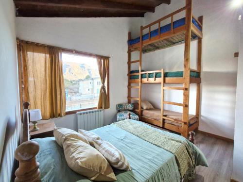 Кровать или кровати в номере Casa Refúgio Patagonia