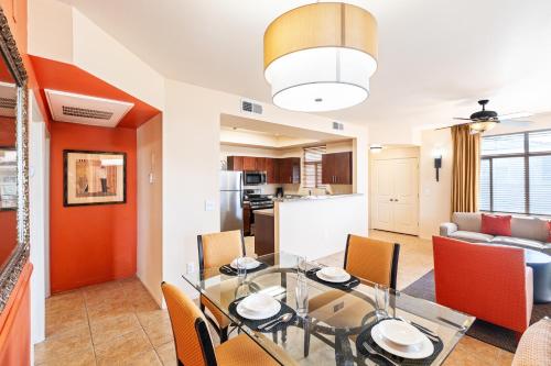 a dining room and living room with a table and chairs at The Cliffs at Peace Canyon in Las Vegas