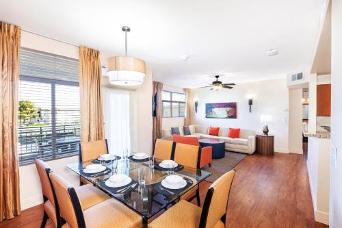 a dining room and living room with a table and chairs at The Cliffs at Peace Canyon in Las Vegas