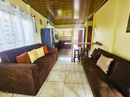 a living room with two couches and a table at Hormiga's Houses in Fortuna