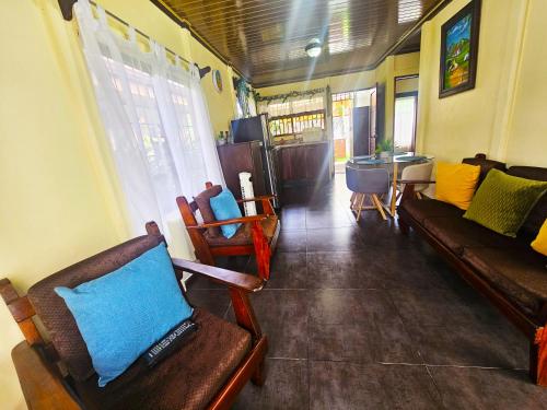 a living room with couches and chairs and a table at Hormiga's Houses in Fortuna