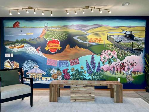 a room with a large mural on the wall at 14 Person Adventure Oasis with Hotub in Wenatchee