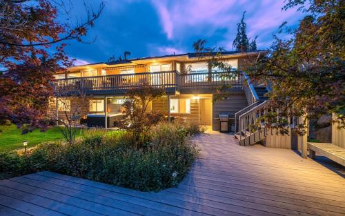 a house with a deck and a balcony at 14 Person Adventure Oasis with Hotub in Wenatchee