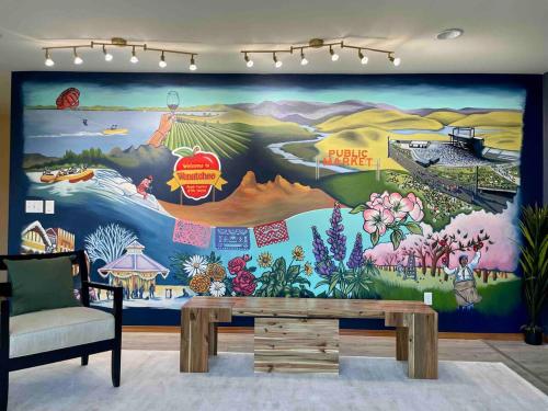 a room with a large mural on the wall at 14 Person Adventure Oasis with Hotub in Wenatchee
